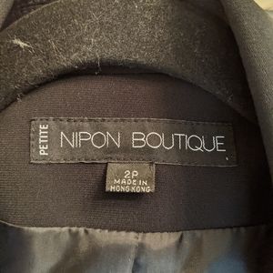 Nipon Boutique Black jacket with white stitching.